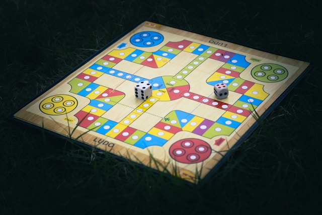 Colourful Ludo board with tokens and dice